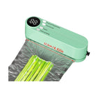 Green vacuum sealer sealing vegetables